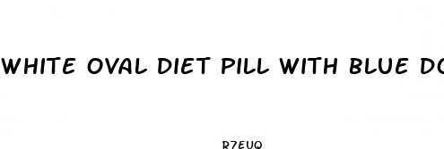 white oval diet pill with blue dots