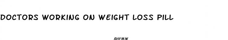 doctors working on weight loss pill
